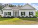 Charming single-story home featuring a manicured lawn, white siding, and black shutters at 1500 Sunmeadow Dr., Conway, SC 29526