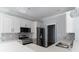 Modern kitchen features white cabinetry, stainless steel appliances, and sleek countertops for a stylish cooking space at 1500 Sunmeadow Dr., Conway, SC 29526
