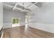 Spacious living room features wood floors, coffered ceilings, a ceiling fan, and a slider to the backyard at 1500 Sunmeadow Dr., Conway, SC 29526
