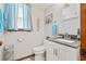 Clean bathroom featuring a grey vanity and blue accents at 1502 Yaupon Dr. # A-1, Myrtle Beach, SC 29577