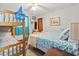 Cozy bedroom featuring a bunk bed, a twin bed, and bright, cheerful decor at 1502 Yaupon Dr. # A-1, Myrtle Beach, SC 29577