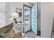 Bright entryway with white furnishings, decor, and a teal door at 1502 Yaupon Dr. # A-1, Myrtle Beach, SC 29577