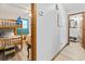 Hallway showcasing wooden trim, leading to a bedroom with bunk beds and a bathroom with a sink and mirror at 1502 Yaupon Dr. # A-1, Myrtle Beach, SC 29577