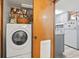Convenient laundry area with washer/dryer, storage shelves, and easy access to the kitchen at 1502 Yaupon Dr. # A-1, Myrtle Beach, SC 29577