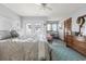 Spacious main bedroom with a king-size bed, access to a private balcony, and a dresser at 1502 Yaupon Dr. # A-1, Myrtle Beach, SC 29577