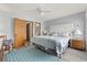 Large main bedroom with a king bed, ensuite bath access, and great natural light at 1502 Yaupon Dr. # A-1, Myrtle Beach, SC 29577