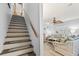Wooden staircase leading to the upper level, providing access to the home's living spaces at 1502 Yaupon Dr. # A-1, Myrtle Beach, SC 29577