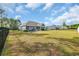 Expansive backyard with ample space for outdoor activities, a fire pit, patio, and privacy fencing at 1509 Osage Dr., Myrtle Beach, SC 29579