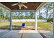 Inviting covered patio with a swing set and beautiful views of the well-maintained yard and surrounding trees at 1509 Osage Dr., Myrtle Beach, SC 29579