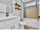 Bright bathroom with tiled shower, decorative shelves, modern vanity, and attractive fixtures at 1509 Osage Dr., Myrtle Beach, SC 29579