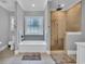 Modern bathroom featuring a shower with decorative tile, a bathtub, and a window at 1509 Osage Dr., Myrtle Beach, SC 29579
