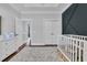 Stylish bedroom featuring a dark accent wall, modern crib, and neutral decor with soft carpeting at 1509 Osage Dr., Myrtle Beach, SC 29579