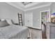 Comfortable bedroom featuring hardwood floors, natural light, neutral colors, and a minimalist design at 1509 Osage Dr., Myrtle Beach, SC 29579