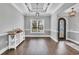 Formal dining room featuring a decorative trey ceiling, wood floors, and a stylish bar at 1509 Osage Dr., Myrtle Beach, SC 29579