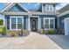 Inviting home featuring a unique decorative front door, complemented by stone accents at 1509 Osage Dr., Myrtle Beach, SC 29579
