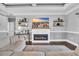 Beautiful living room featuring a fireplace, a large screen TV, and decorative shelving at 1509 Osage Dr., Myrtle Beach, SC 29579