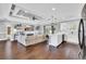 Open concept living space featuring a modern island, white kitchen, fireplace, and sofa at 1509 Osage Dr., Myrtle Beach, SC 29579