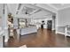 Open-concept living room featuring dark wood floors, a fireplace, and a bright kitchen at 1509 Osage Dr., Myrtle Beach, SC 29579