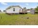 Spacious backyard with a garden, deck, and outbuilding at 175 Cypress Ln., Little River, SC 29566