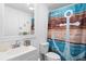 Clean bathroom featuring a patterned shower curtain, vanity with mirror, and modern fixtures at 175 Cypress Ln., Little River, SC 29566
