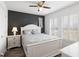 Comfortable bedroom with a queen bed, stylish nightstand, and bright natural lighting at 175 Cypress Ln., Little River, SC 29566