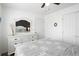 Bedroom featuring a dresser with a large mirror and view of queen bed at 175 Cypress Ln., Little River, SC 29566
