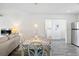 Bright dining room featuring a decorative table setting and seamless transition to the living area at 175 Cypress Ln., Little River, SC 29566