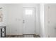 Clean, minimalist entryway with white door and neutral decor for a welcoming feel at 175 Cypress Ln., Little River, SC 29566