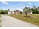 Charming single-Gathering home featuring a brick facade, landscaped yard, and separate garage at 175 Cypress Ln., Little River, SC 29566