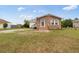 Well-maintained brick home with a cozy front porch and freshly mowed lawn at 175 Cypress Ln., Little River, SC 29566