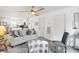 Relaxing living area with stylish sofa, ceiling fan, and an open layout to the kitchen at 175 Cypress Ln., Little River, SC 29566
