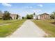 Charming street view showcasing well-maintained lawns and inviting homes, creating a welcoming neighborhood atmosphere at 175 Cypress Ln., Little River, SC 29566