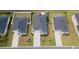 An aerial view of a well maintained home showing the roof, driveway, and curated landscaping in a suburban setting at 179 S Reindeer Rd., Surfside Beach, SC 29575