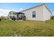 Large, grassy backyard with patio and fire pit, perfect for entertaining at 179 S Reindeer Rd., Surfside Beach, SC 29575