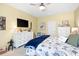 Relaxing bedroom with a dresser, TV, and coastal-themed decor for a serene retreat at 179 S Reindeer Rd., Surfside Beach, SC 29575
