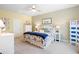 Comfortable bedroom with neutral carpet, complemented by stylish furnishings and coastal-themed decor accents at 179 S Reindeer Rd., Surfside Beach, SC 29575