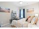 Inviting bedroom with starfish-themed bedding and coastal-inspired artwork at 179 S Reindeer Rd., Surfside Beach, SC 29575