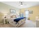 Cozy bedroom features a ceiling fan, coastal decor, and soft lighting for a tranquil and inviting space at 179 S Reindeer Rd., Surfside Beach, SC 29575