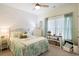 Cozy bedroom featuring a stylish bed, bright natural light, and charming decor for a warm and inviting atmosphere at 179 S Reindeer Rd., Surfside Beach, SC 29575