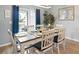 Dining room with a dining table and seating for six, complemented by natural lighting and coastal decor at 179 S Reindeer Rd., Surfside Beach, SC 29575