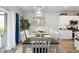 Light-filled dining room with modern decor, seamlessly connecting to the kitchen for convenient entertaining at 179 S Reindeer Rd., Surfside Beach, SC 29575