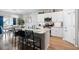 Modern kitchen with granite countertops, stainless steel appliances, and an island with bar stools at 179 S Reindeer Rd., Surfside Beach, SC 29575