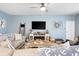 Inviting living room with comfortable seating, a fireplace, and stylish decor, creating a cozy ambiance at 179 S Reindeer Rd., Surfside Beach, SC 29575