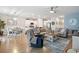 Open-concept living space connects the kitchen, dining area, and living room, providing seamless flow and functionality at 179 S Reindeer Rd., Surfside Beach, SC 29575