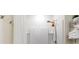 A well-lit shower with a shower head and shelves for storage at 179 S Reindeer Rd., Surfside Beach, SC 29575