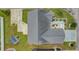 Overhead view of the home showcasing landscaping, concrete driveway, and detached storage shed at 207 Cupola Dr., Longs, SC 29568
