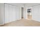 Bedroom featuring carpet, closet, and a doorway leading to the kitchen at 207 Cupola Dr., Longs, SC 29568