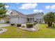 Well-maintained home with manicured lawn, mature landscaping, and an attached garage at 207 Cupola Dr., Longs, SC 29568