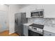 Contemporary kitchen with stainless steel appliances, granite countertops, and modern cabinetry at 207 Cupola Dr., Longs, SC 29568