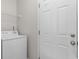 Laundry room featuring a washing machine, white walls, and a door at 207 Cupola Dr., Longs, SC 29568
